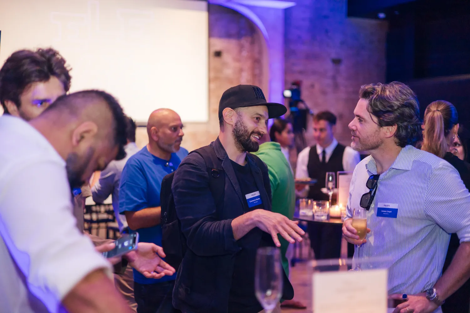 Guests networking over drinks at Elevate